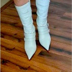 Michelle K white boots with silver hardware bucles.
